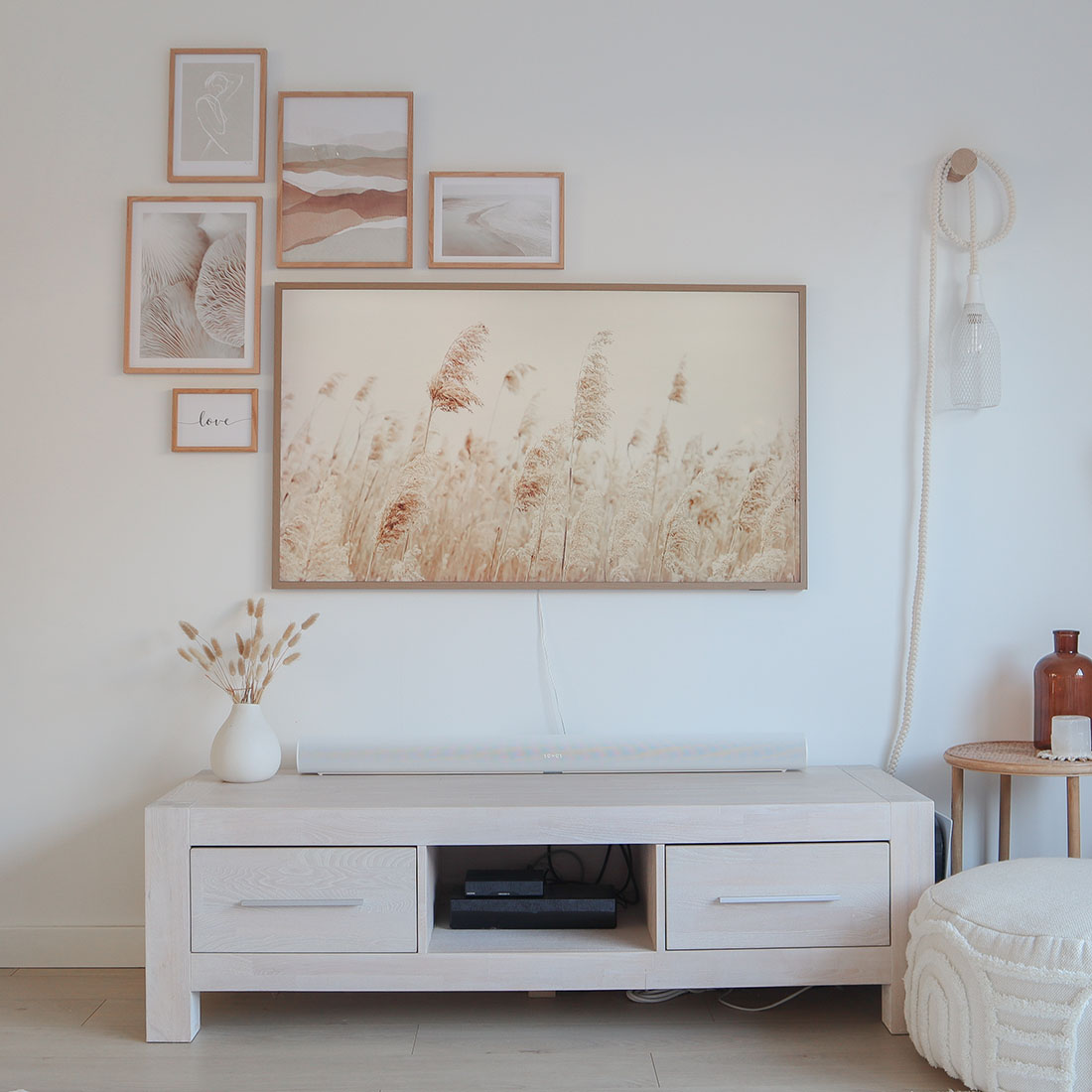 A neutral gallery wall around the Samsung Frame TV